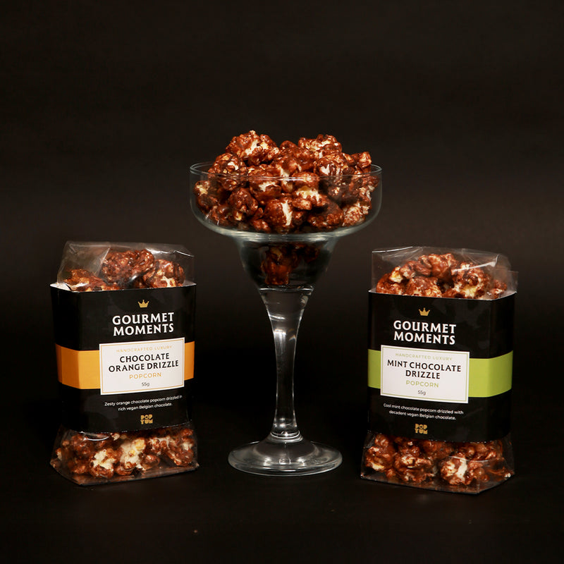 Vegan Belgian chocolate drizzled popcorn hamper featuring chocolate orange and mint chocolate flavors.