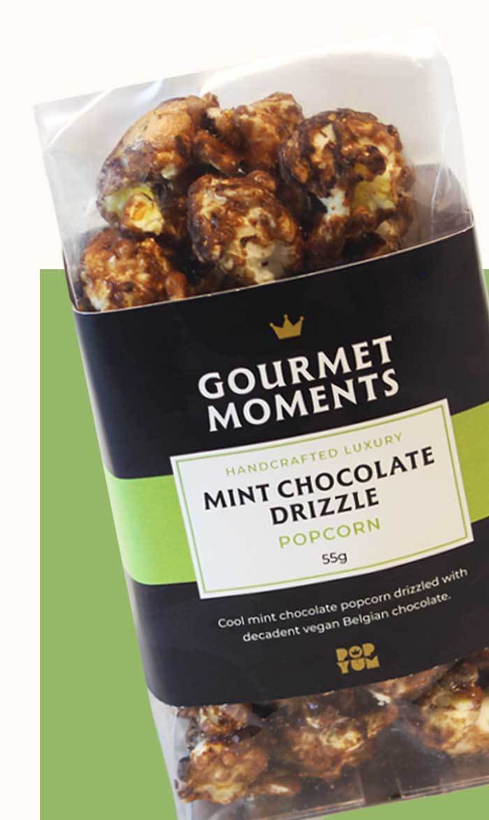 Packaged Gourmet Moments Mint Chocolate Drizzle popcorn on a white background.