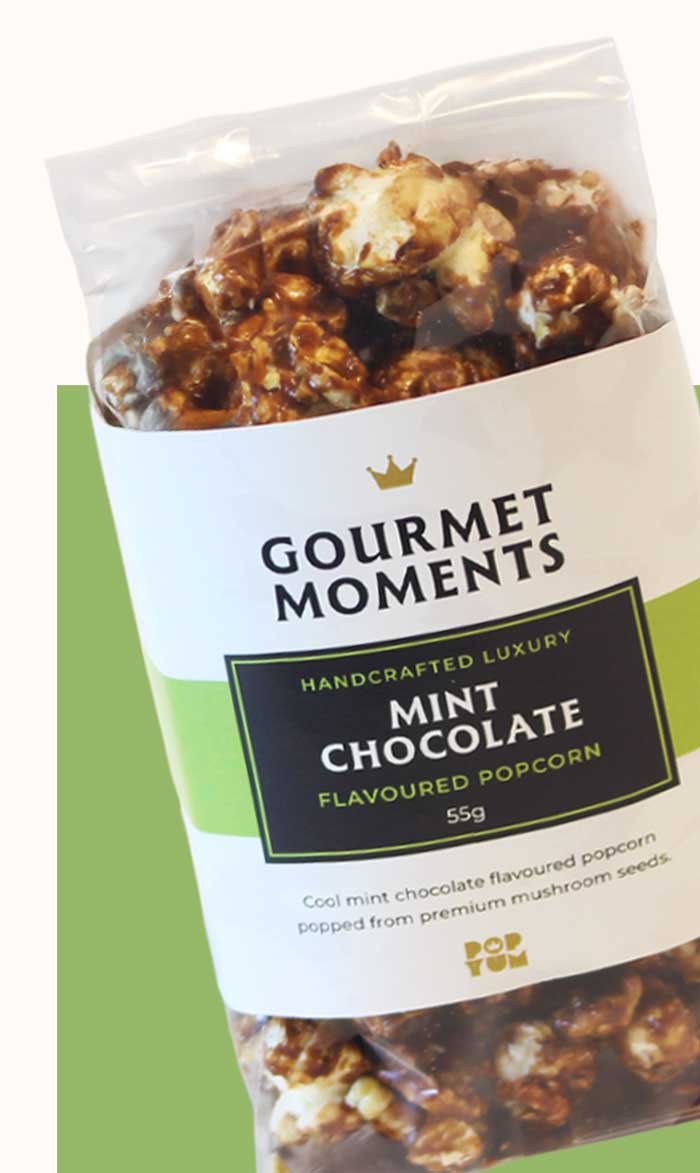 Packaged Gourmet Moments Mint Chocolate flavoured popcorn on a white background.