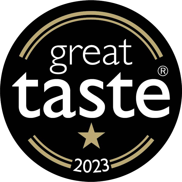 Great Taste 2023 logo with a star on a black background, representing Pop Yum's salted caramel Great Taste award. 