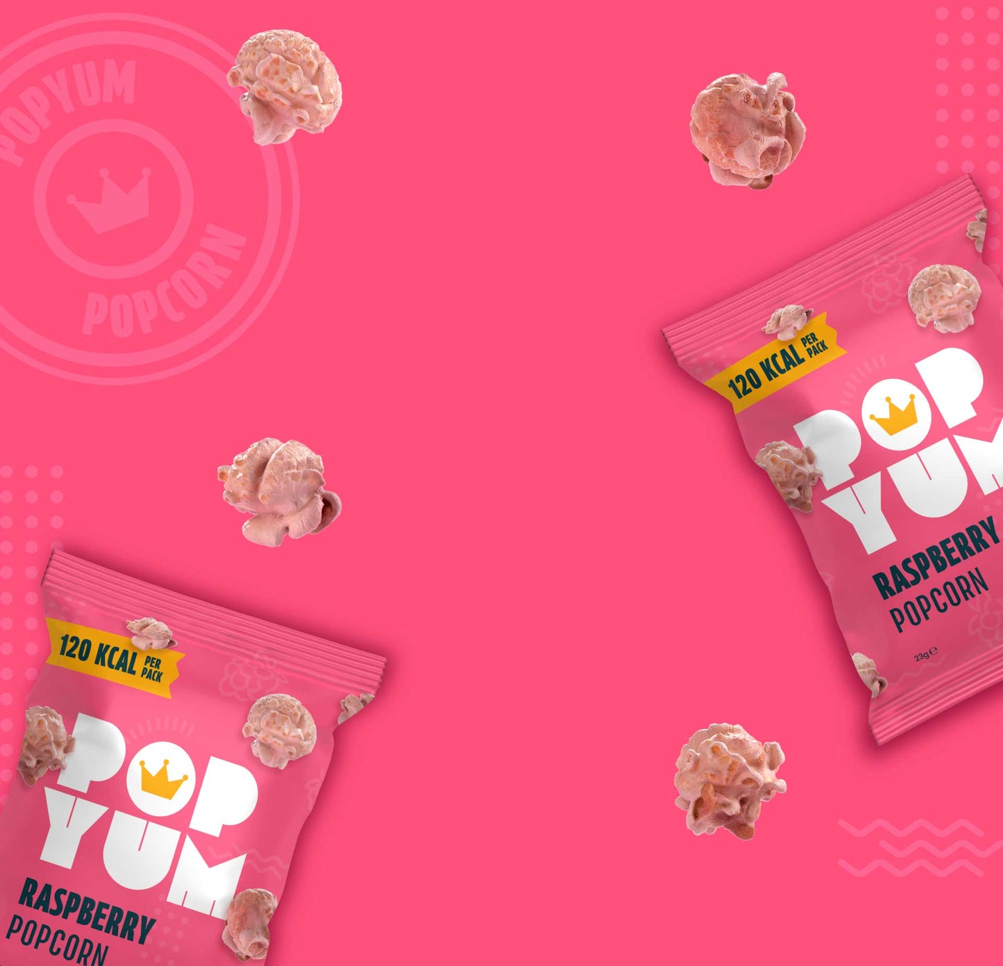 Pink Pop Yum raspberry flavoured popcorn packaging on a pink background with scattered popcorn pieces.