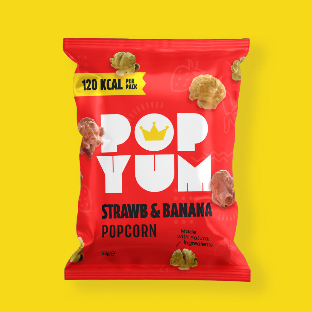 Red package of the gluten-free snack Pop Yum strawberry banana popcorn on a yellow background, with 120kcal per pack shown.