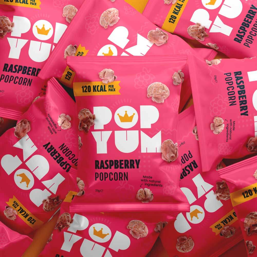 Pink Pop Yum raspberry popcorn packets, visible branding and product details such as "made with natural ingredients."