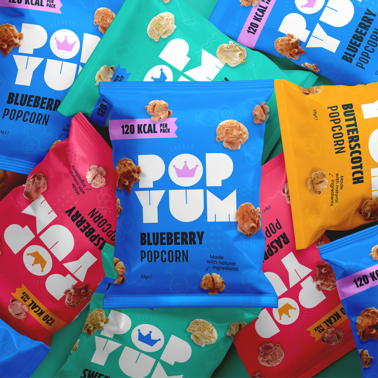 Multicoloured background featuring Pop Yum vegan & gluten-free popcorn in colourful packaging with various flavours.