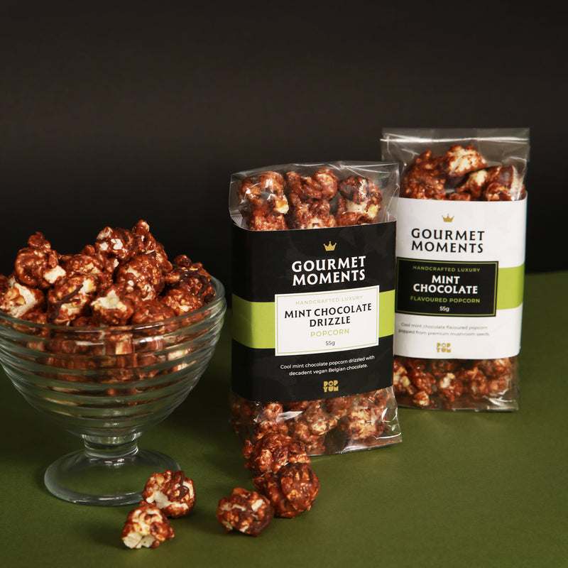 Vegan Mint Chocolate Drizzled popcorn in a bowl with Gourmet Moments packaging, perfect for indulgent snacking.