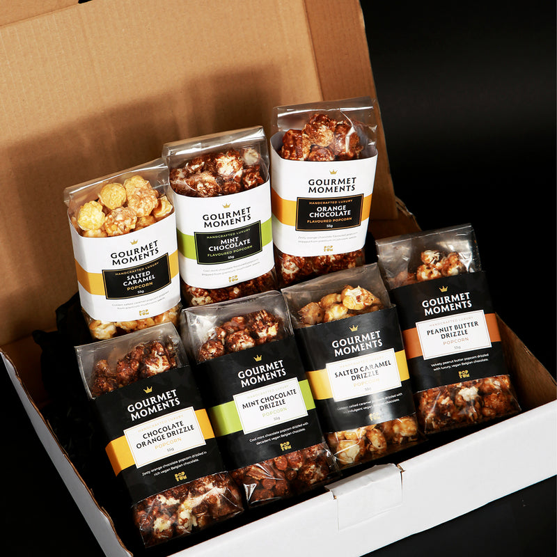 Vegan Belgian Chocolate Drizzled Popcorn Hamper with 7 refined flavours in a stylish gift box.