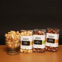 Vegan Belgian Chocolate drizzled popcorn hamper featuring salted caramel and orange chocolate flavors.